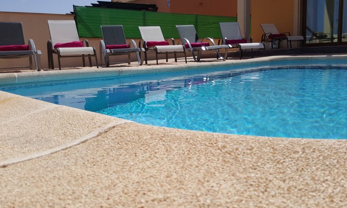 Caleta de Fuste Villa | Beautiful, spacious villa, heated pool, sleeps eight, with quality furnishings