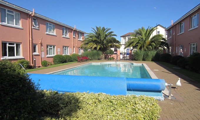 Paignton Apartment | Best location! 2 mins from Paignton's sandy beach and pier. Outdoor heated pool