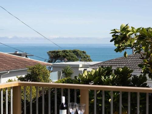 Rewa House | Blue Water Cottage - with beachfront coastal views