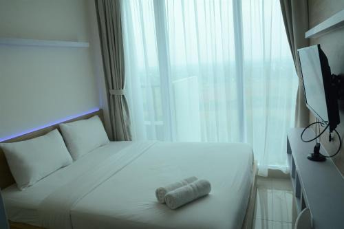Serpong Apartment | Brand New Studio Tree Park City BSD Apartment near ICE BSD By Travelio
