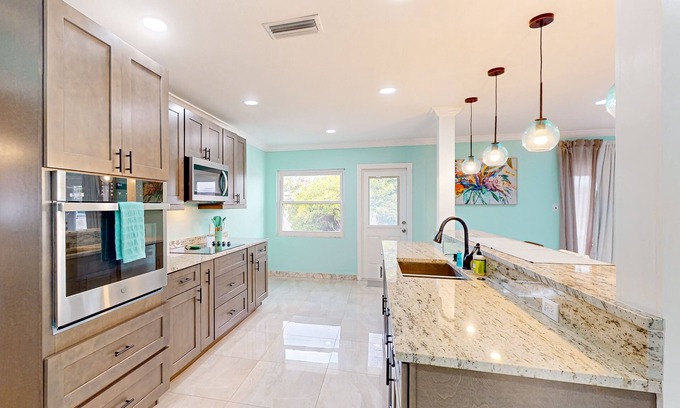 Davis Islands House | Brick beauty with private yard, BBQ, patio, AC, & W/D