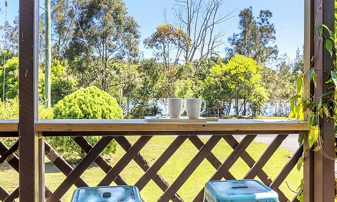 Mylestom Cabin | Cabin 1 – The Suite. Relax in comfort and get back to nature in 1 of 4 waterside Cabins