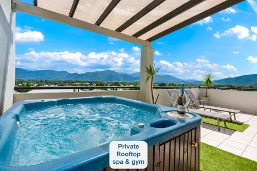 Cairns Apartment | Cairns Penthouse - Private Rooftop Outdoor Gym, Spa & TV Area with Sunset & Mountain Views