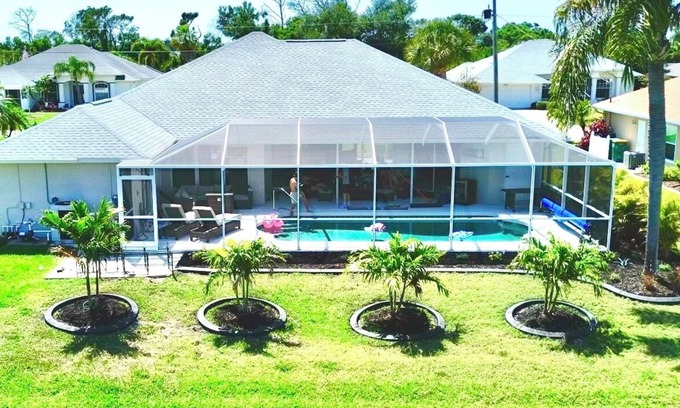 Pinehurst House | Canal Front Charm: Heated Pool, Firepit & Breathtaking Sunset Views
