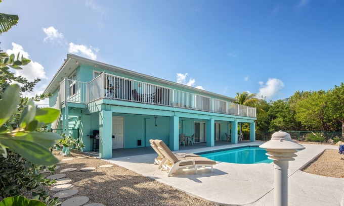 Marathon House | Canal-front, dog-friendly home with heated pool, seawall dock & grill