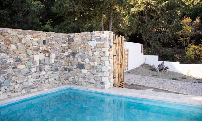 Kos House | Chaihoutes stone villa into Olive farm in Zia