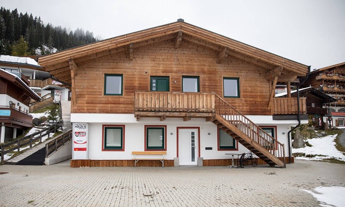 Konigsleiten Apartment | Chalet Hirsch is furnished in a rural style