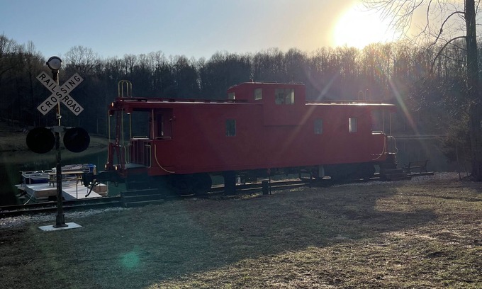 Freedom Bed & Breakfast | Charming Caboose-turned-tiny home on lake