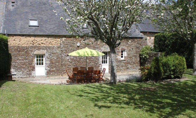 Canville-la-Rocque Cottage | Charming Home Near Portbail Beaches, Enclosed Yard, Fireplace, and Garage