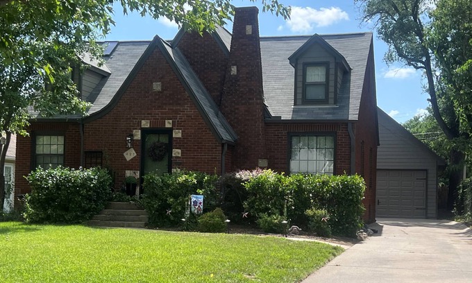 Wichita House | Charming Tudor Retreat in Perfect Location with Fenced Yard and Garage