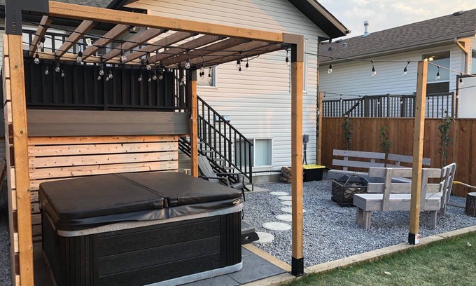 Red Deer House | Cheerful, cozy 4 bedroom house w/hot tub and firepit area
