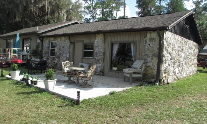 Hernando Cottage | Cheerful water front stone cottage. With beach. on bike trail.