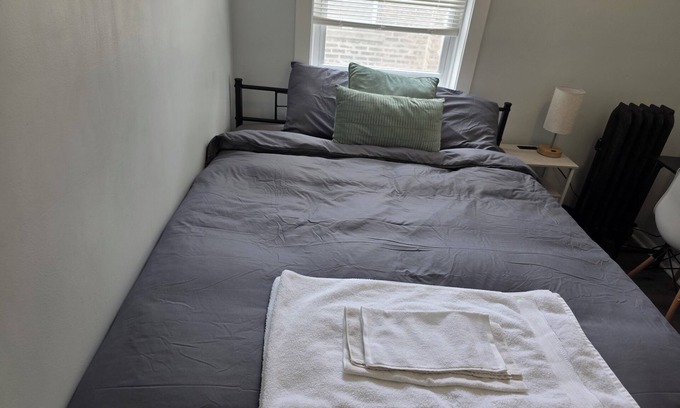 Grand Boulevard Apartment | Chic private bedroom housing close to public transportation to the loop.