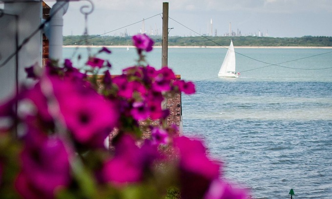 Cowes House | Coastal cottage with sea views, lovely village location, 2 mins from seafront.