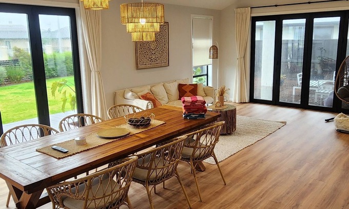 Papamoa Beach House | Coastal spacious 4-bedroom house close to beach with spa.