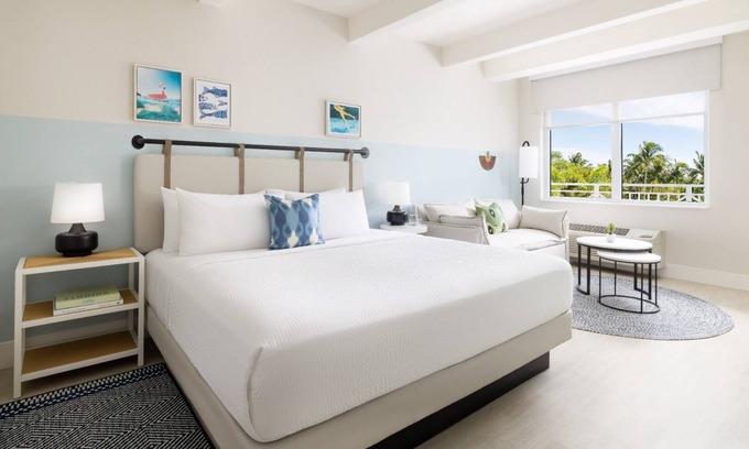 New Town Hotel | Colorful Stay at Blue Flamingo | Poolside Bar, Lawn Games, Music & Fire Pits