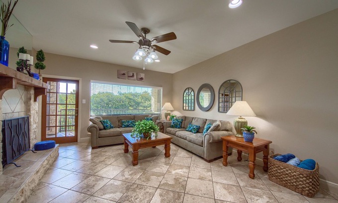 New Braunfels Condo | Comal Riverfront with 2 decks! Schlitterbahn! Pool, hot tub & river access!