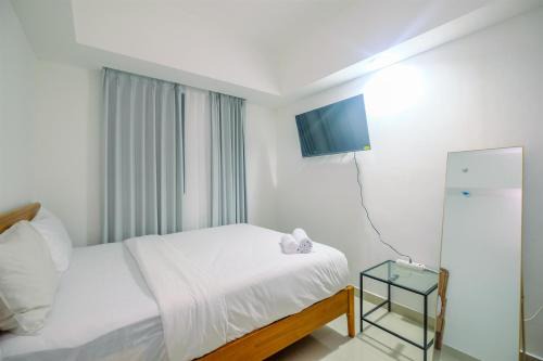 Pondokcina Apartment | Comfort 1BR Apartment at Evenciio Margonda By Travelio
