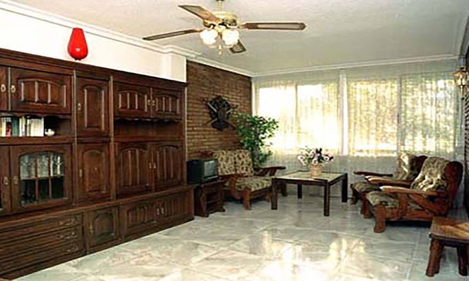 Alicante Apartment | Comfortable conditioned apartment with three dormitories sorrounded by gardens.
