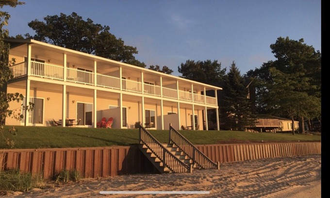 Port Austin Condo | Condo #1 Ground level end unit. Walk right out to the beach!