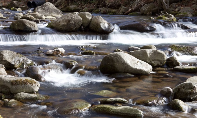Gatlinburg Condo | Convenient Creekside condo with large wrap around balcony, close to everything!