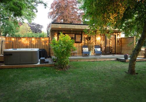 Toppesfield House | Copper Beech Lodge with Hot Tub, Games Room, Fire Pit