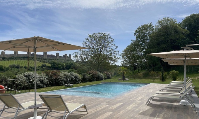 Monteriggioni Apartment | Cosy apartment for 2 guests with pool, WIFI, A/C, TV, pets allowed and parking, close to Siena