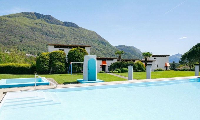 Capriasca Apartment | Cosy apartment for 5 people with WIFI, pool, TV, patio, pets allowed and panoramic view