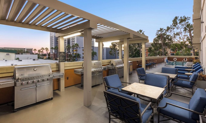 Anaheim Resort Hotel | Cozy 2 Unit Stay: Queen Beds, Full Kitchens, Parking, Fitness, Pool & Shuttle!