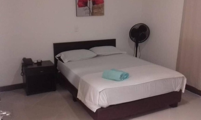 Florida Nueva Hotel | Cozy bedroom in charming Medellín with WiFi