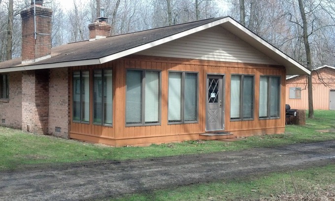 Au Gres Cabin | Cozy Cabin in the Woods- close access, private road to dock & Lake Huron access.