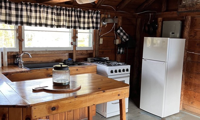 Rangeley Plantation Cabin | Cozy cabin on the water with fantastic views of Mooselookmeguntic Lake.