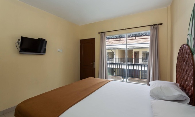 Denpasar Barat House | Cozy co-living that has two buildings separated by a pool to cool down and relax