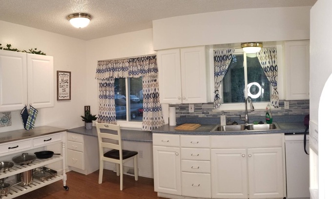 Summit Station House | Cozy Family friendly 4 bedroom house, mins from Downtown with hot tub in bedroom