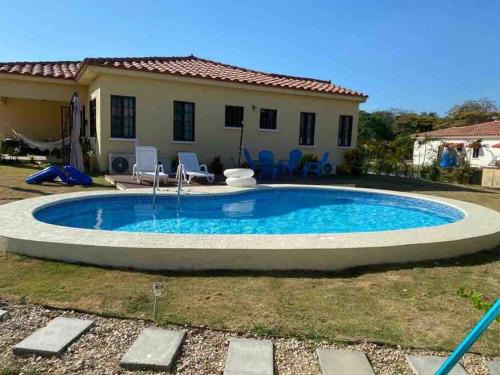 El Palmar House | Cozy Home with pool near Beach in gated comunity