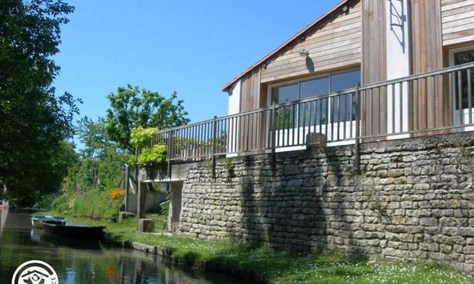 Damvix Cottage | Cozy Riverside Cottage with Canoes, Terrace & Garden in Charming Damvix