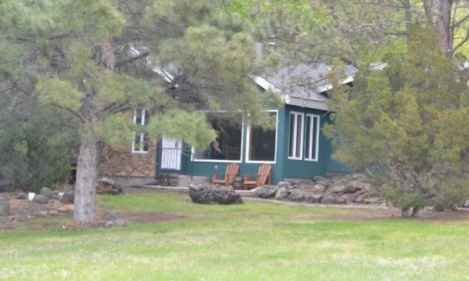 Wapiti Cabin | Creekworks Cabin- Wapiti Valley, surrounded by trees with creek access