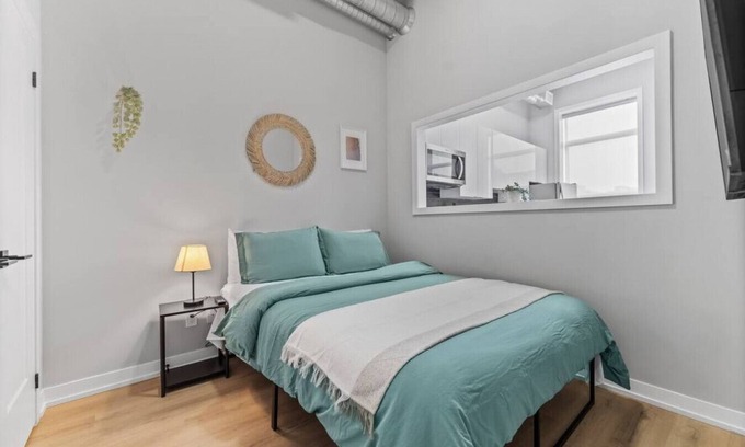 Peterborough Apartment | Designer Loft 1BR Exposed Brick Bay Windows