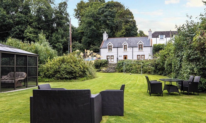 Newton Stewart Cottage | Detached property with a lovely garden leading down to the River Cree near Newton Stewart.