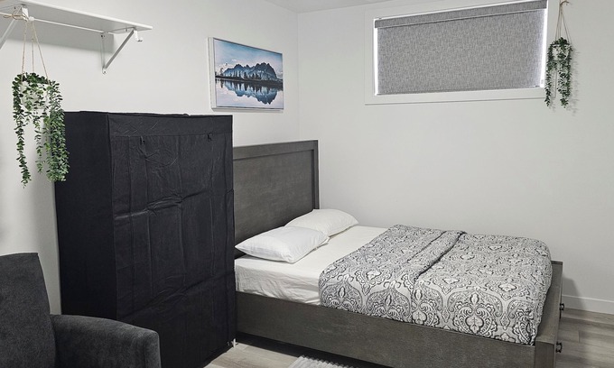 Saskatoon Apartment | "Discover Dominion's Crib! This chic and cozy space is ideal for travelers.