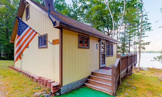 Eddington Cabin | Dog-friendly lakefront cottage with firepit, grill, partial AC, bar, loft & TV