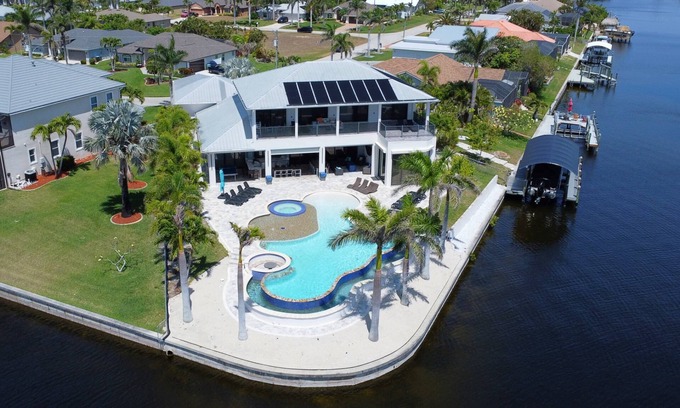 Pelican House | Dream Home Vacation! Stunning Waterfront! Luxurious Resort-Style Lagoon Pool, Spa & Outdoor Living!