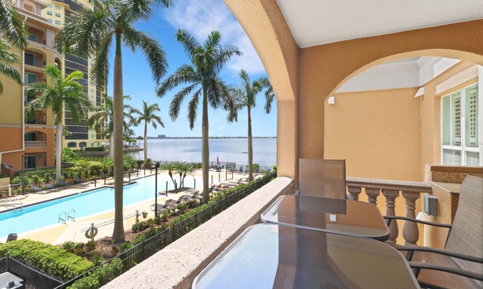 Fort Myers Condo | Elegant, Upscale Waterfront Condo! Unforgettable Sunsets! Stunning Pool & Pool Deck! Free Parking