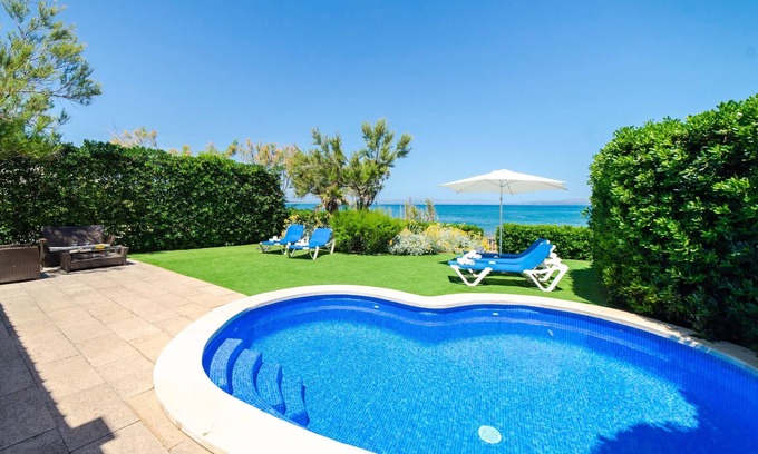 Urbanizacion S'Estanyol Villa | EMBAT - Seafront house with garden, pool and bbq.