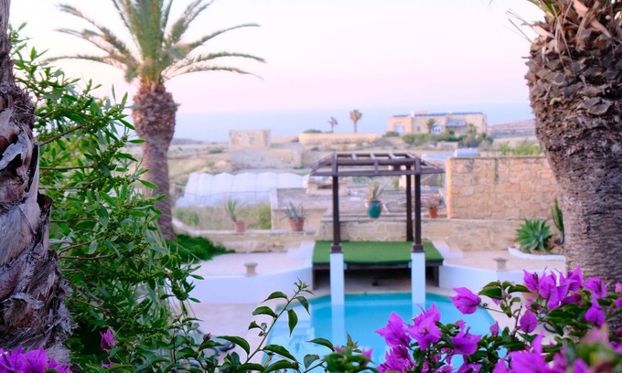 Gharb House | Enchanting converted farmhouse with private pool and mature garden with seaviews