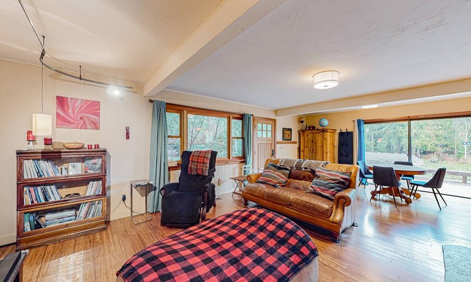 Sandpoint House | Enchanting dog-friendly alpine retreat with hot tub, deck, fire pit, W/D & views