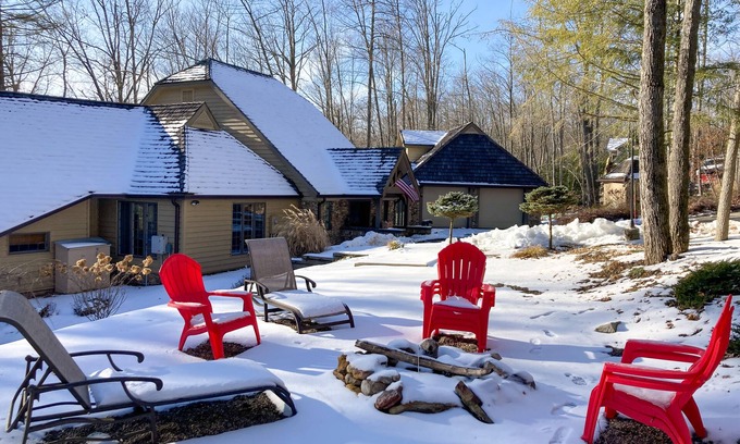 McHenry House | Enchanting waterfront home with hot tub, game room, fireplace, & washer/dryer