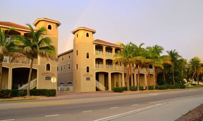 Mid Island Condo | Enjoy Coastal Chic living and views of the gulf from your top floor balcony.
