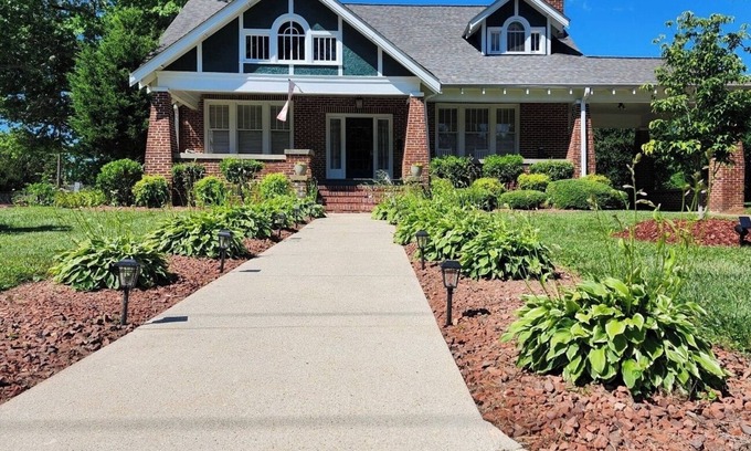 Mount Airy House | Enjoy small-town, Main Street from the front porch of this historic bungalow!