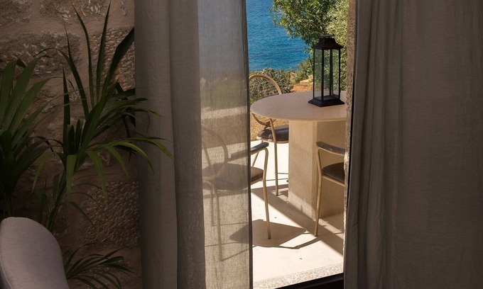 Stoupa Villa | Enjoy the relaxation of chic seaside living in a sea view stone villa